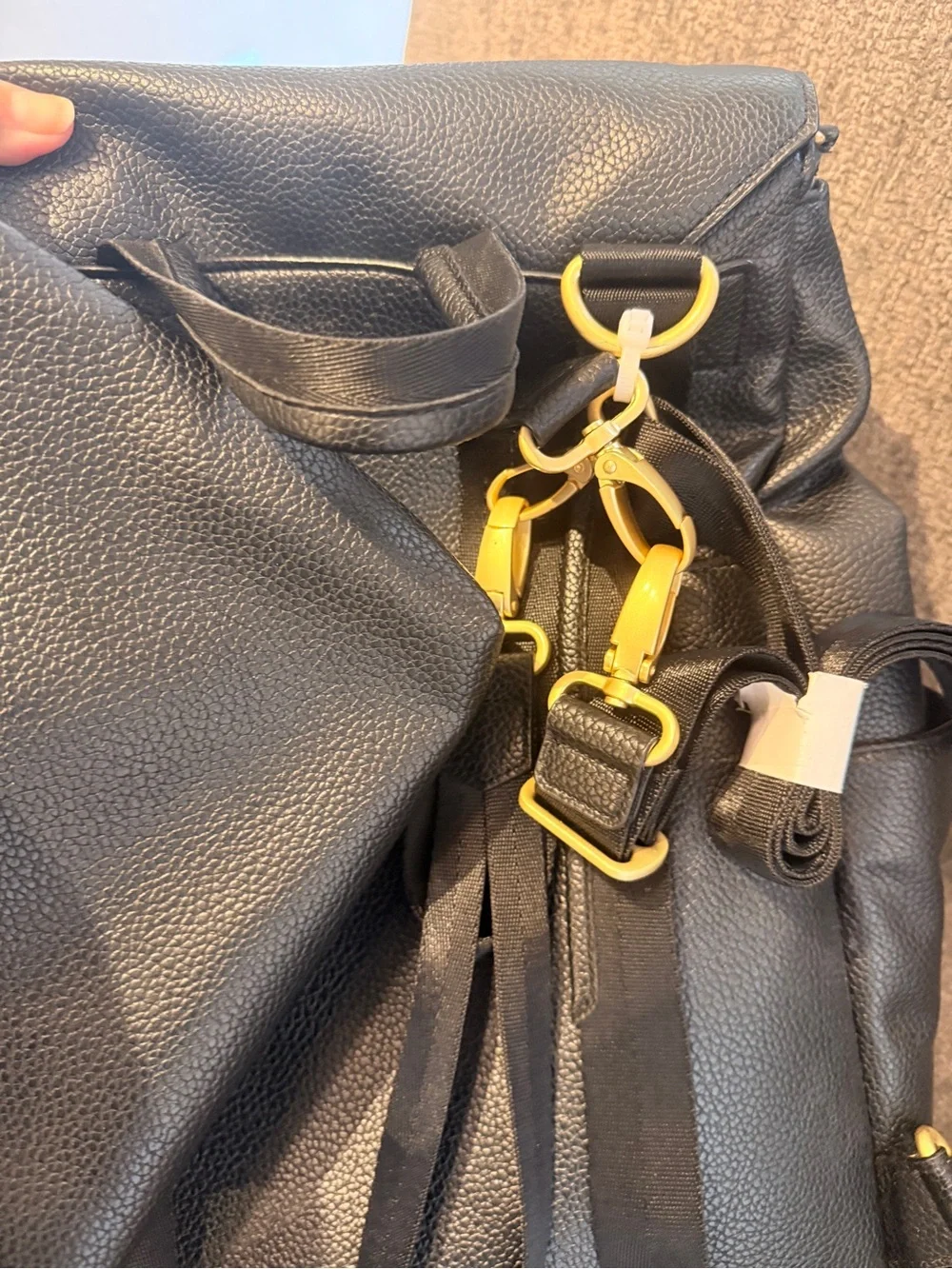 FP Black Leather Fold-Top Backpack with Gold Accents